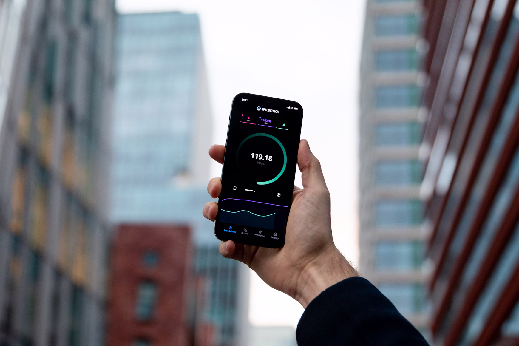 A person viewing a speed test on their phone, showing high download speed