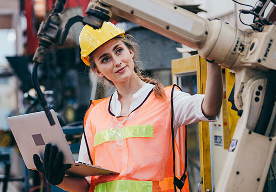 lady using heavy machinery in an industrial environment