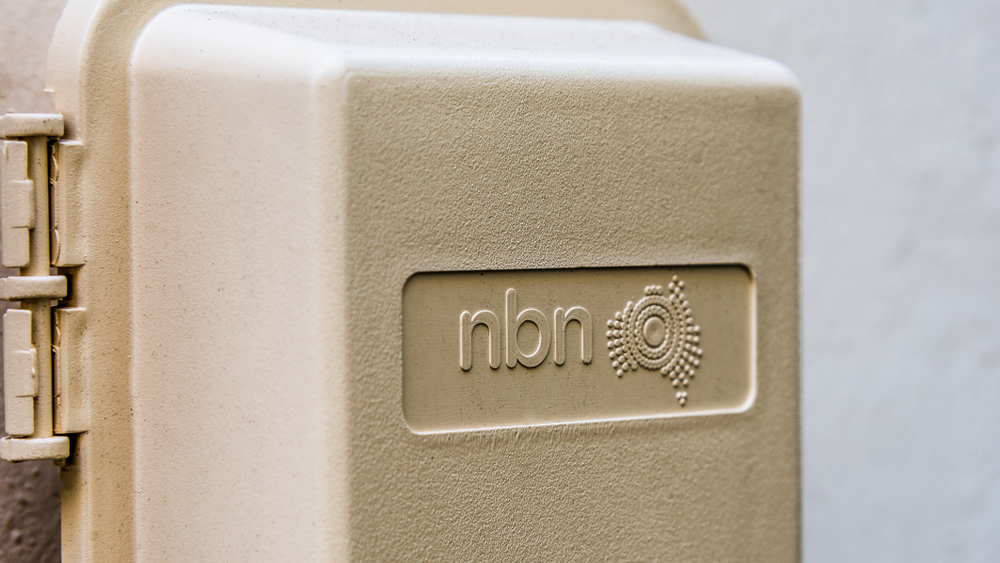 Close-up of an nbn™ connection box mounted on an exterior wall.