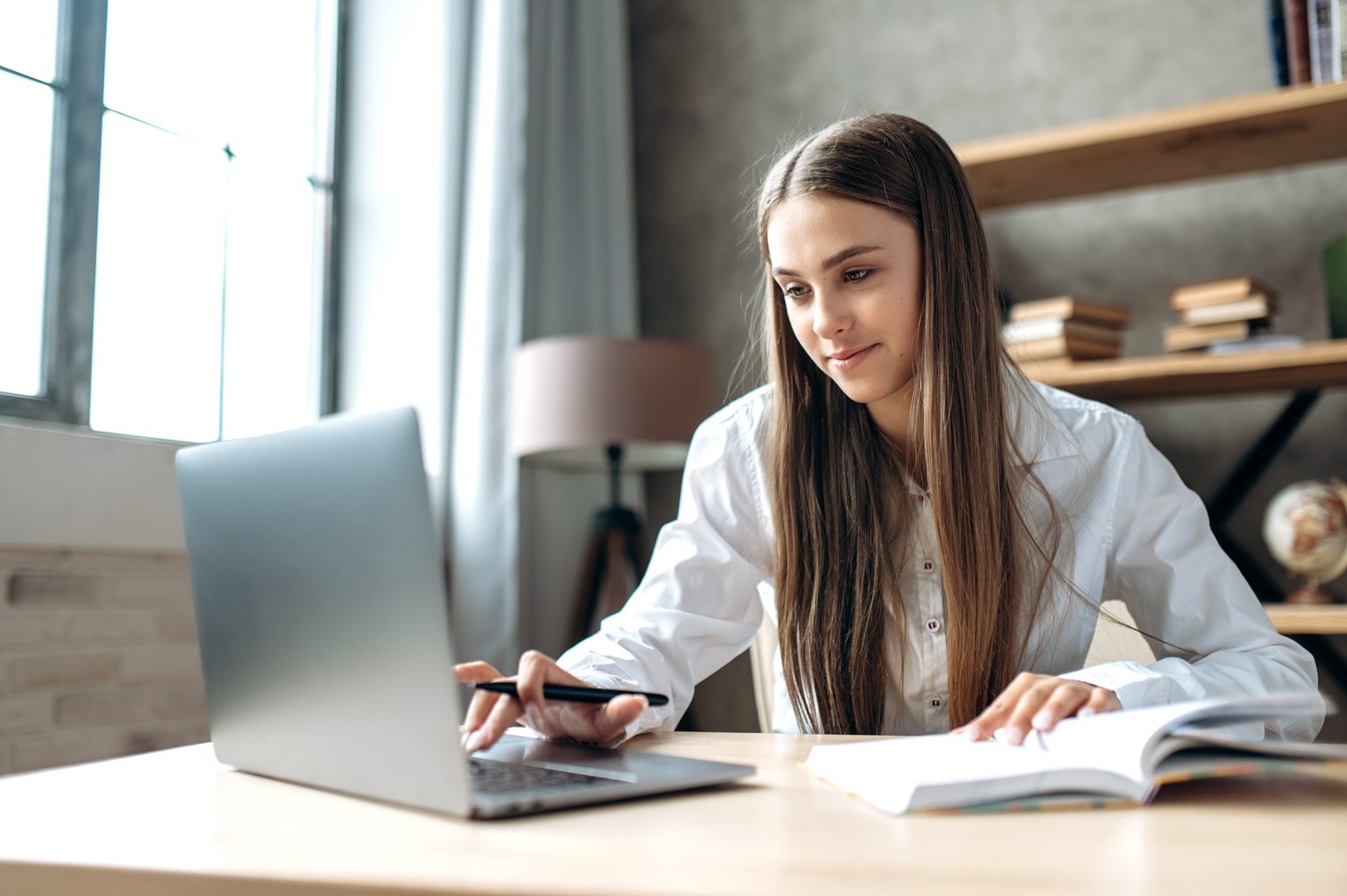 Woman sitting at a desk using a laptop
